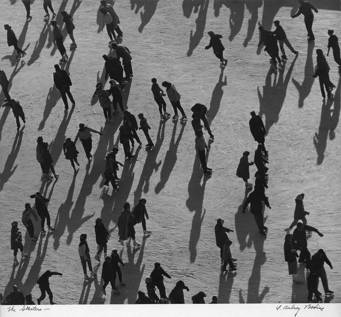 A. Aubrey Bodine: The Skaters: A. Aubrey Bodine: The Skaters, 1961, vintage silver print, signed and titled on mount recto, titled and photographer's stamps on mount verso, Image size: 15.8"x14"; Sheet Size: flush mounted to board 
