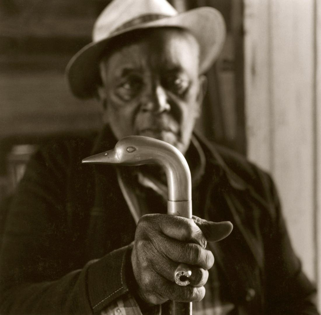 Jack Spencer: Hooter with Cane, Coila, Mississippi: Jack Spencer: Hooter with Cane, Coila, Mississippi, 1996, toned silver print, ed. 65/100, signed and numbered recto; titled, numbered, and initialed verso, Image size: 9.25"x9.375"; Sheet Size: 13.75"