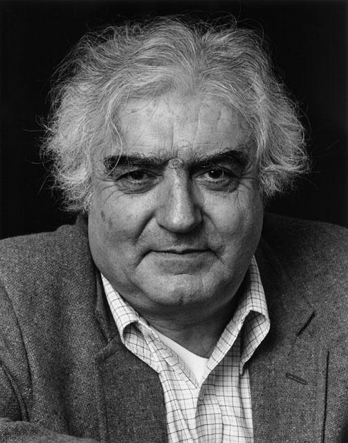 Abe Aronow: Cornell Capa at his ICP office, NYC, 1984/2010, silver print, signed recto, initialed verso, 11"x14".