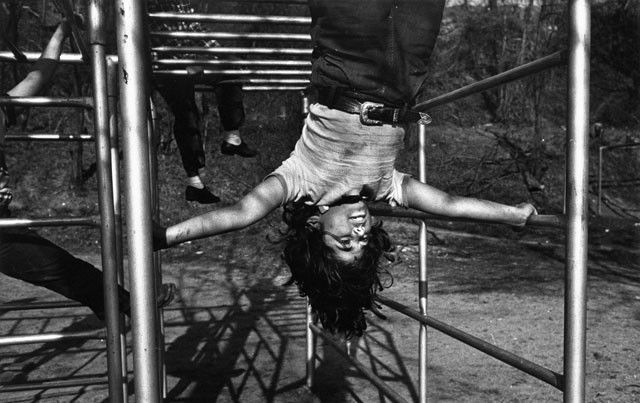 W. Eugene Smith: Juanita on Jungle Gym, 1944/c. 1950s, silver print, Photograph by W. Eugene Smith stamp on print verso, 8.5"x13.625".