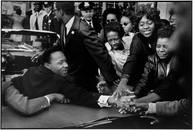 Leonard Freed:  Baltimore, Maryland. Dr. Martin Luther King Jr. being greeted on his return to the