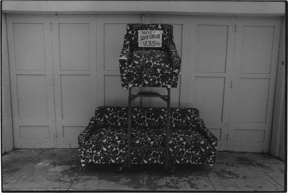 Nathan Lyons: Untitled (sofa and chair) from the series Notations in Passing: Nathan Lyons: Untitled (sofa and chair) from the series Notations in Passing, c. 1971, vintage gelatin silver print, signed on mount, Image size: 4.5" x 6.5"; Sheet Size: 6.6875" x 4.5".