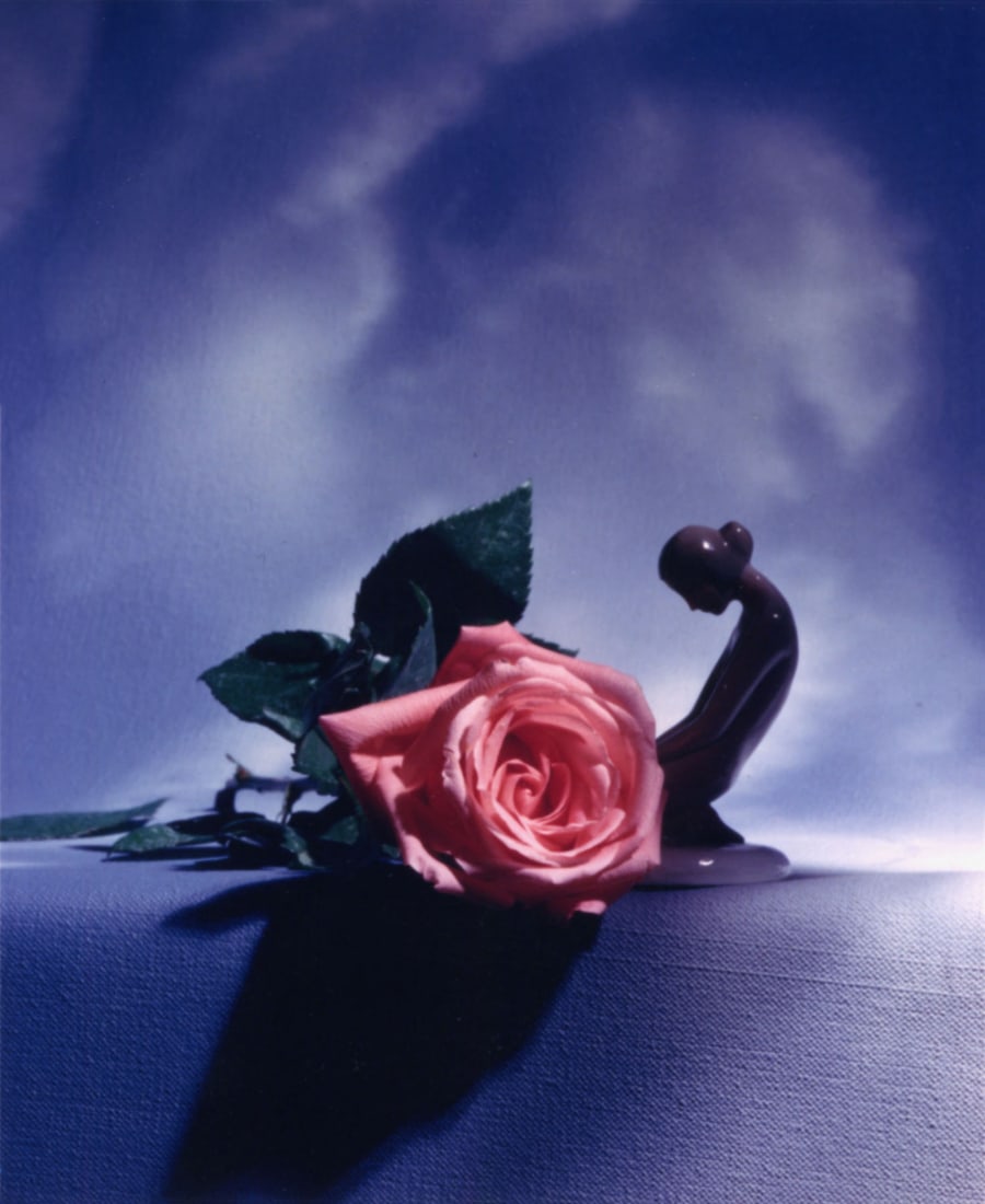 Horst P. Horst: pink rose on table with female sculpture, attached to holiday card: Horst P. Horst: pink rose on table with female sculpture, attached to holiday card, c. 1980, chromogenic print, signed on card, Image size: 5.125" x 4.25"; Sheet Size: 6.75" x 4.75".