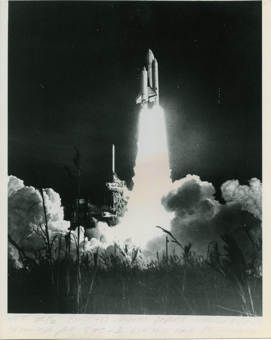 New York Times Photo Library: Launch of the first Space Shuttle Mission (Columbia): New York Times Photo Library: Launch of the first Space Shuttle Mission (Columbia), 1981, gelatin silver print, caption on recto; NYT Photo library stamp on verso, Image size: 9.125" x 7.5"; Sheet Siz
