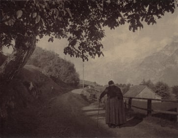 Unknown: Untitled [woman with cane on a country road]