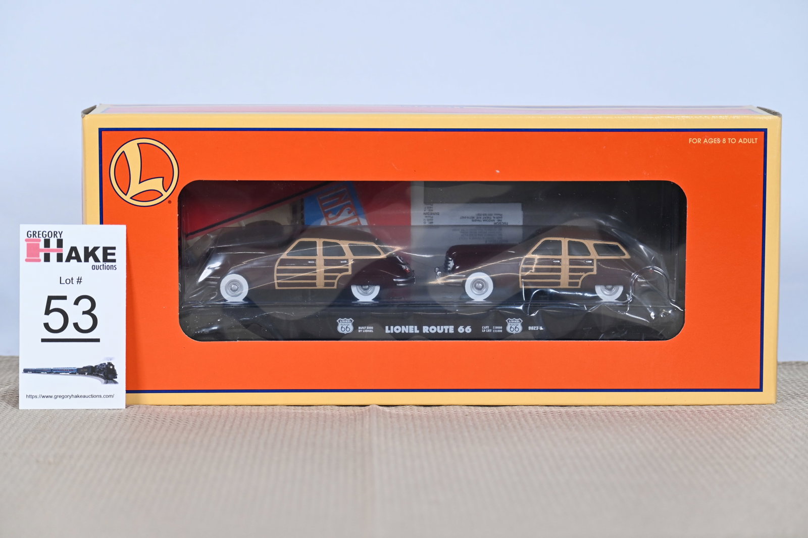 Lionel (LTI) - 17558: (O Gauge) Route 66 - Flat Car with brown sedans, Car No. 9823-8 w/OB: Lionel (LTI) - 17558: (O Gauge) Route 66 - Flat Car with brown sedans, Car No. 9823-8 / in Original Box / Condition: C10