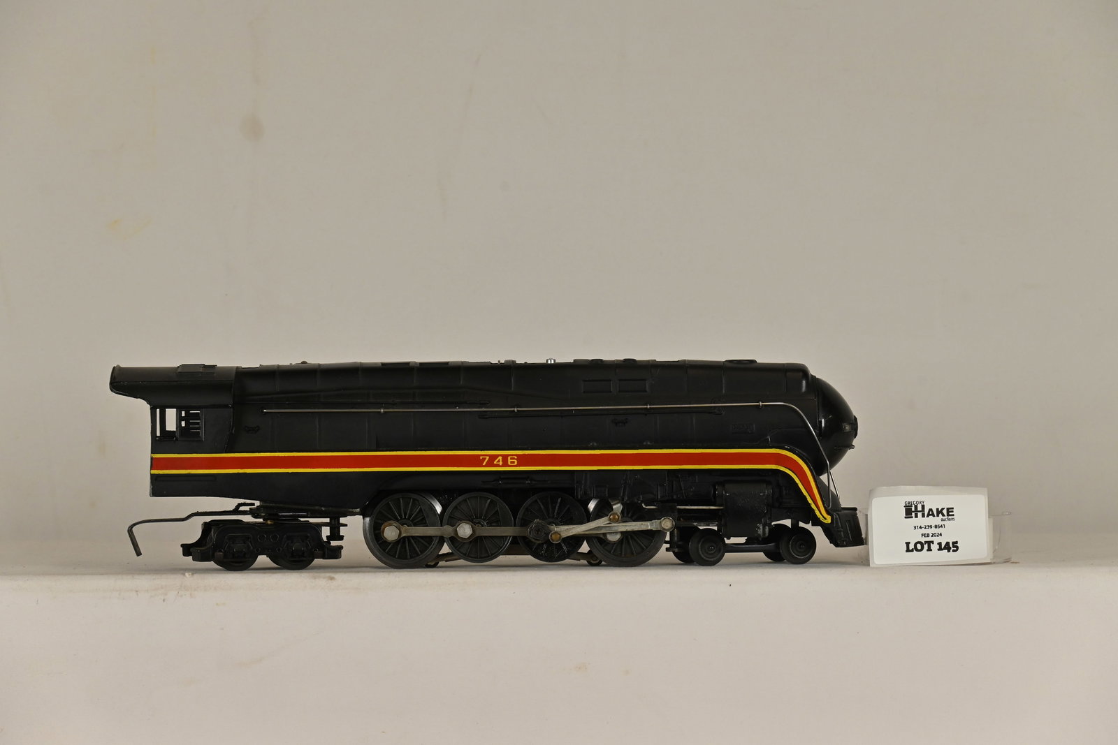 Lionel Postwar 746 Norfolk & Western J Steam Locomotive: Lionel Postwar 746 Norfolk & Western J Steam Locomotive. Loco is Beautiful. The stripes are very solid with no breaks or scratches. Loco is C7+. The boiler front is aftermarket.
