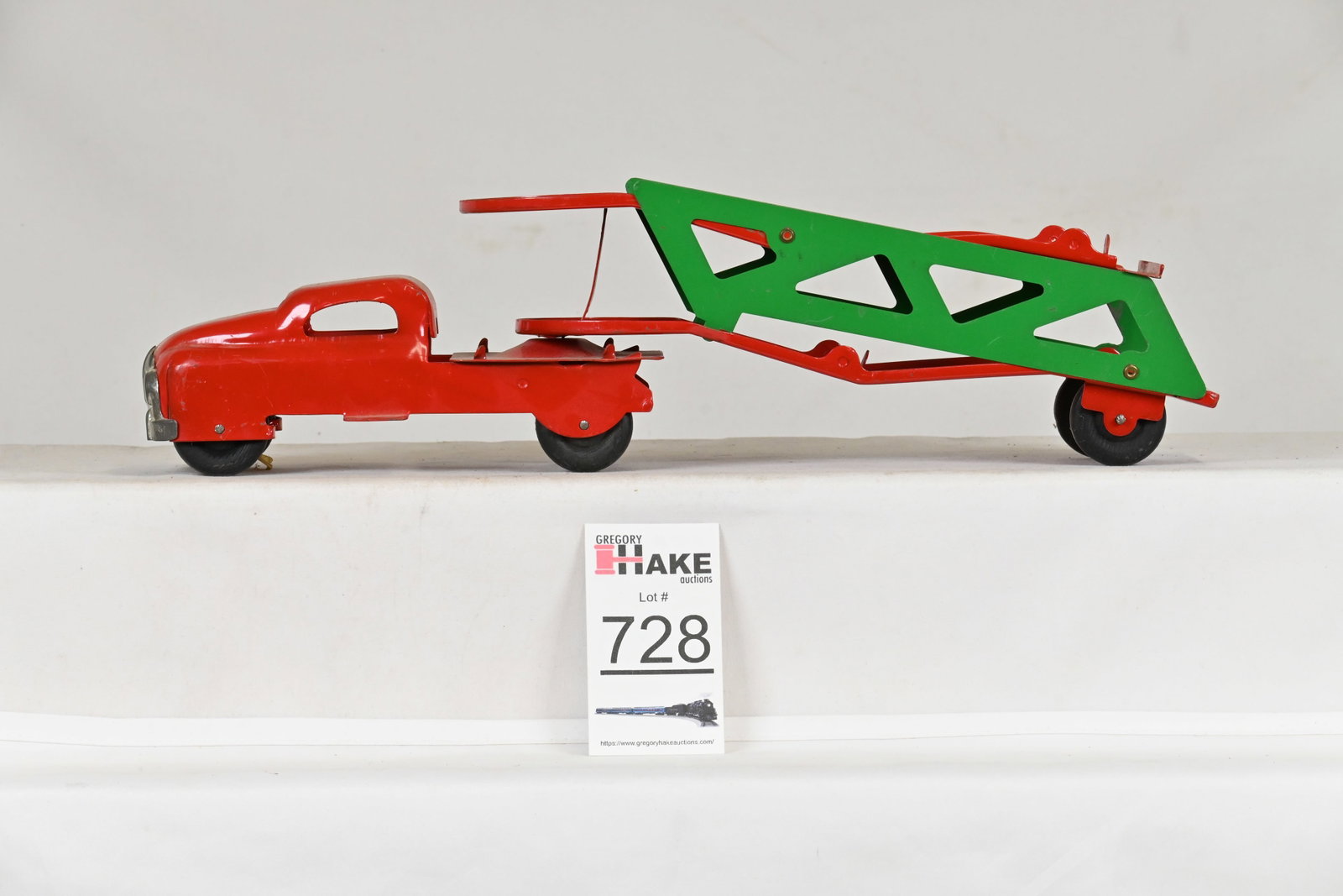 Pressed Steel Red/Green Truck Autoloader: Pressed Steel Red/Green Truck Autoloader, C8. There are no markings. Piece is about 16" long.