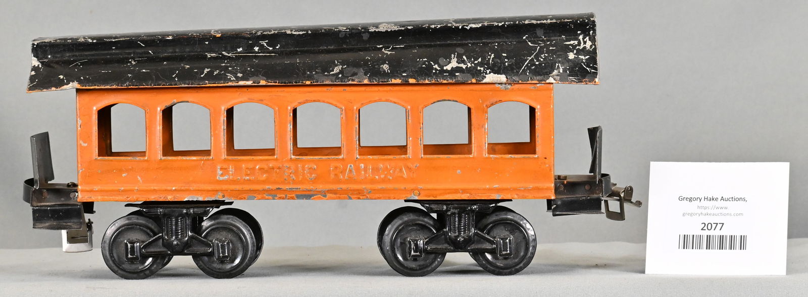 Carlisle & Finch Prewar Orange/Black #13 Coach with ELECTRIC RAILWAY embossed under the windows: Carlisle & Finch Prewar Orange/Black #13 Coach with ELECTRIC RAILWAY embossed under the windows. Has wrong trucks and has added couplers. One end "bumper" is missing, C6
