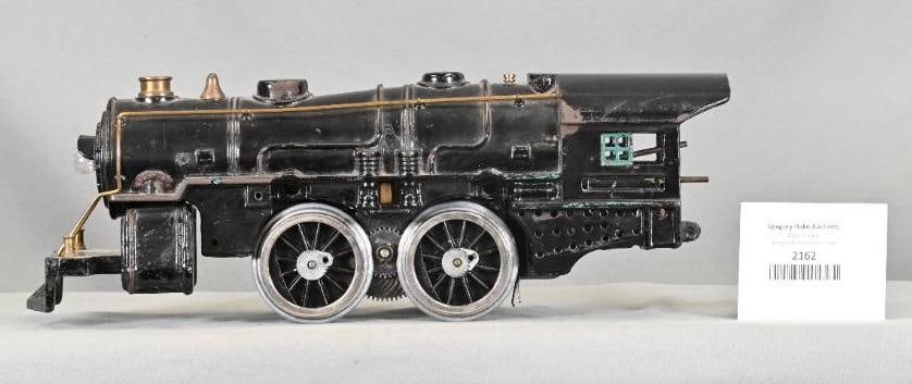 American Flyer Prewar Wide Gauge 2-4-2 Steam Locomotive: American Flyer Prewar Wide Gauge 2-4-2 Steam Locomotive. Original Paint. Front and Rear Trucks are Missing. Replacement Drive Wheels with Missing Side Rods. Motor is loose from shell, C6.
