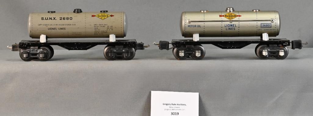 Two Different Lionel Prewar O Gauge 2680 Sunoco Tank Cars: Two Different Lionel Prewar O Gauge 2680 Sunoco Tank Cars, C7/8. One is silver and the other is gray.