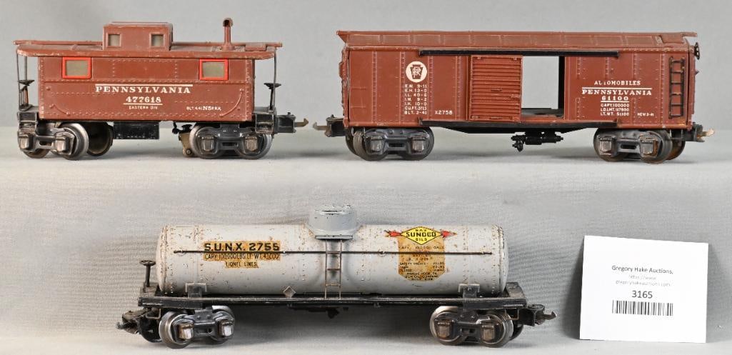 Lionel Prewar O Gauge 2758X Penn. Boxcar, 2755 Gray Sunoco Tank Car and 2757 Penn. Caboose: Lionel Prewar O Gauge 2758X Penn. Boxcar, 2755 Gray Sunoco Tank Car and 2757 Penn. Caboose. Caboose is C7. Boxcar is missing three doors and is C7. Tank Car is C6.