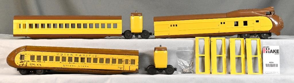 Lionel Prewar O Gauge 752E, 753 and 754 UP Yellow/Brown Streamliner: Lionel Prewar O Gauge 752E, 753 and 754 UP Yellow/Brown Streamliner. The loco and coach have been repainted and need letteringand trim, C7/8. The 754 is original and has a warped belly pan, C5/6. Incl