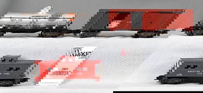 3 American Flyer  freight cars 974 operating merchandise car,24309 Gulf tank car, 938 American Flyer: 3 American Flyer freight cars 974 operating merchandise car, C8; 24309 Gulf tank car, C7; 938 American Flyer Lines painted red caboose, C7.