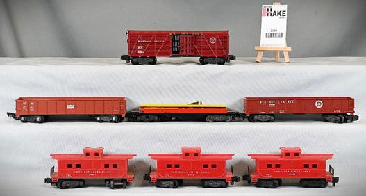 7 American Flyer freight cars: 915; 24016 gondola; 929 cattle car; 641 gondola; 806, 24636, 24627