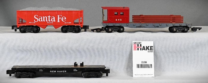 3 American Flyer freight cars, 24225 Santa Fe hopper, 24566 New Haven flatcar, 645 wrecking car