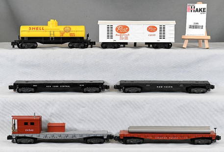 American Flyer Postwar 6 miscelleaneous freight cars: American Flyer Postwar 6 miscelleaneous freight cars incl 24558 flat car, C2001 post car, 24328 Shell tank car, 24546 boom car, 24537 flat carm 24562 flat car, C7