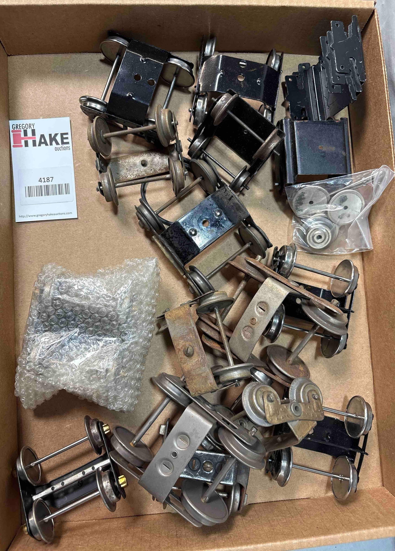 Box Lot of Prewar Standard & O Gauge Wheels & Trucks: Box Lot of Prewar Standard & O Gauge Wheels & Trucks. C5-C7