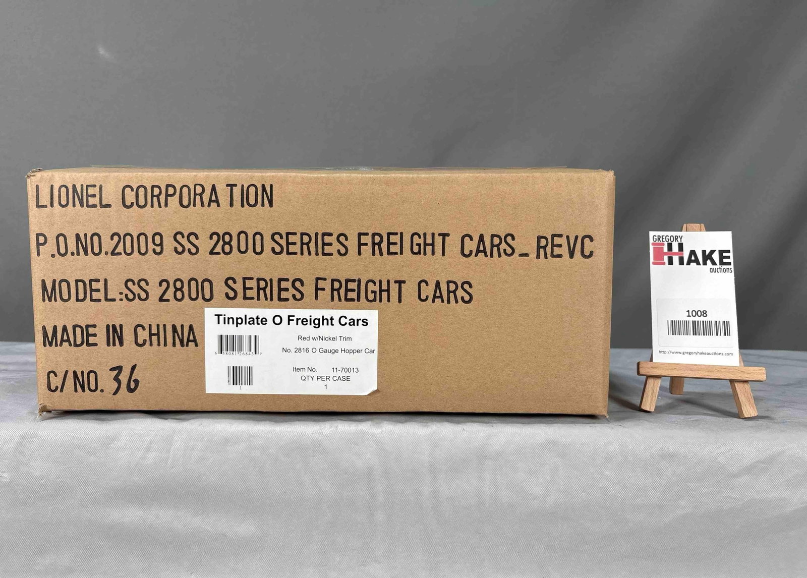 LCT 2816 Coal hopper: Lionel Corporate Tinplate 2816 coal hopper in Bright red with nickel trim livery. MIB condition with OB and factory shipper SKU 11-70013 10