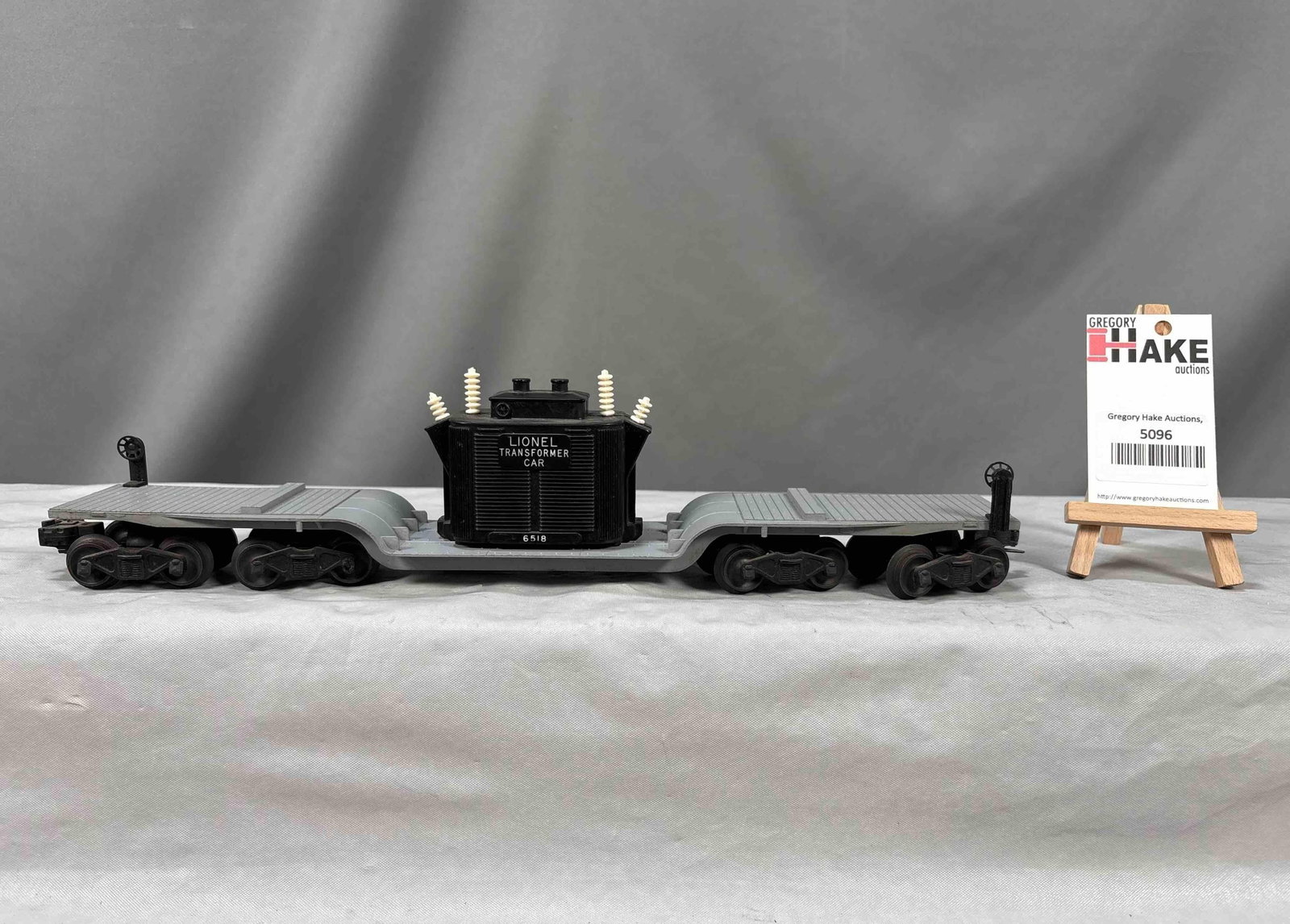 Lionel Postwar 6518 Sixteen Wheel Transformer Car: Lionel Postwar 6518 Sixteen Wheel Transformer Car. Insulators are aftermarket, C7. Size 17x3x4
