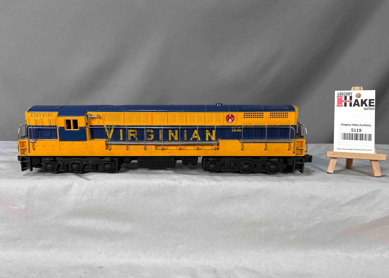 Lionel Postwar 2331 Blue & Yellow Virginian FM Diesel Locomotive: Lionel Postwar 2331 Blue & Yellow Virginian FM Diesel Locomotive. Locomotive has very tight screw hole cracks at each end, otherwise C7. Size 17x3x4