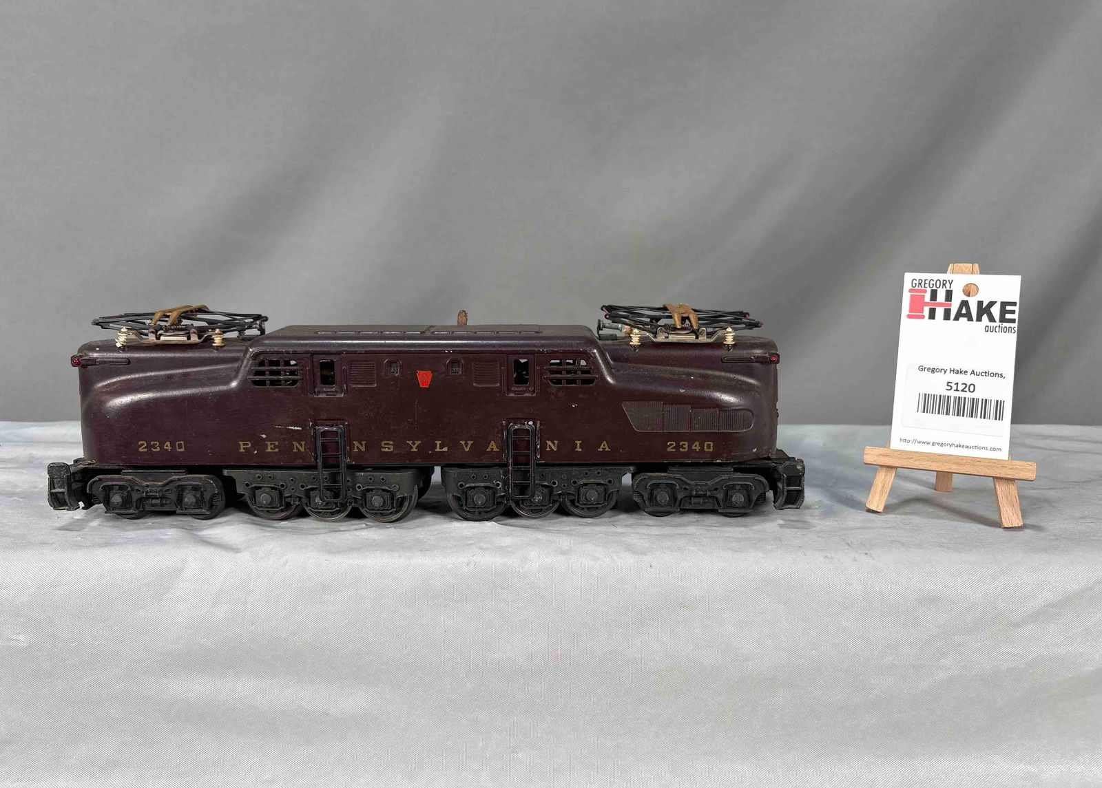 Lionel Postwar 2340 Tuscan Congressional Pennsylvania GG1 Locomotive: Lionel Postwar 2340 Tuscan Congressional Pennsylvania GG1 Locomotive. Stripes have faded otherwise C6. Size 15x3x4