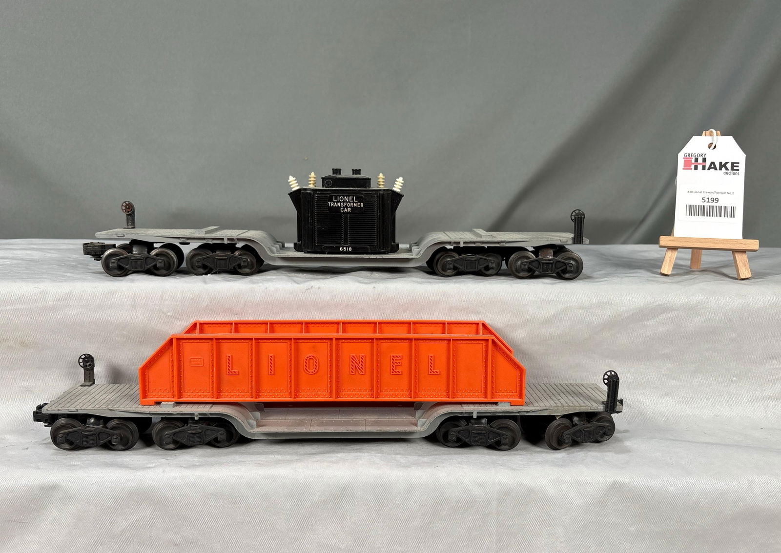 Lionel Postwar 6418 Bridge & 6518 Transformer Depressed Center Flat Cars: Lionel Postwar 6418 Bridge & 6518 Transformer Depressed Center Flat Cars. C7. Insulators are after-market. Size 16x6x4