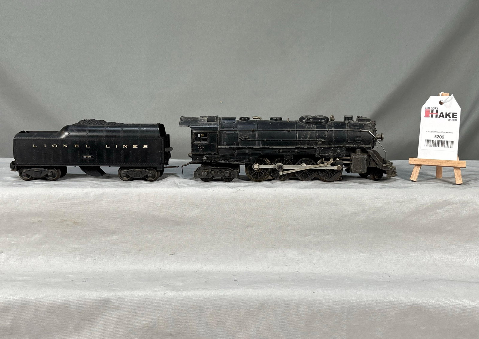 Lionel Postwar 726 RR Korean War Berkshire Locomotive with 2046W Tender: Lionel Postwar 726 RR Korean War Berkshire Locomotive with 2046W Tender. Locomotive needs to be cleaned, otherwise lower C7.� 2046W is later variation with numbers stamped on the sides, also C7