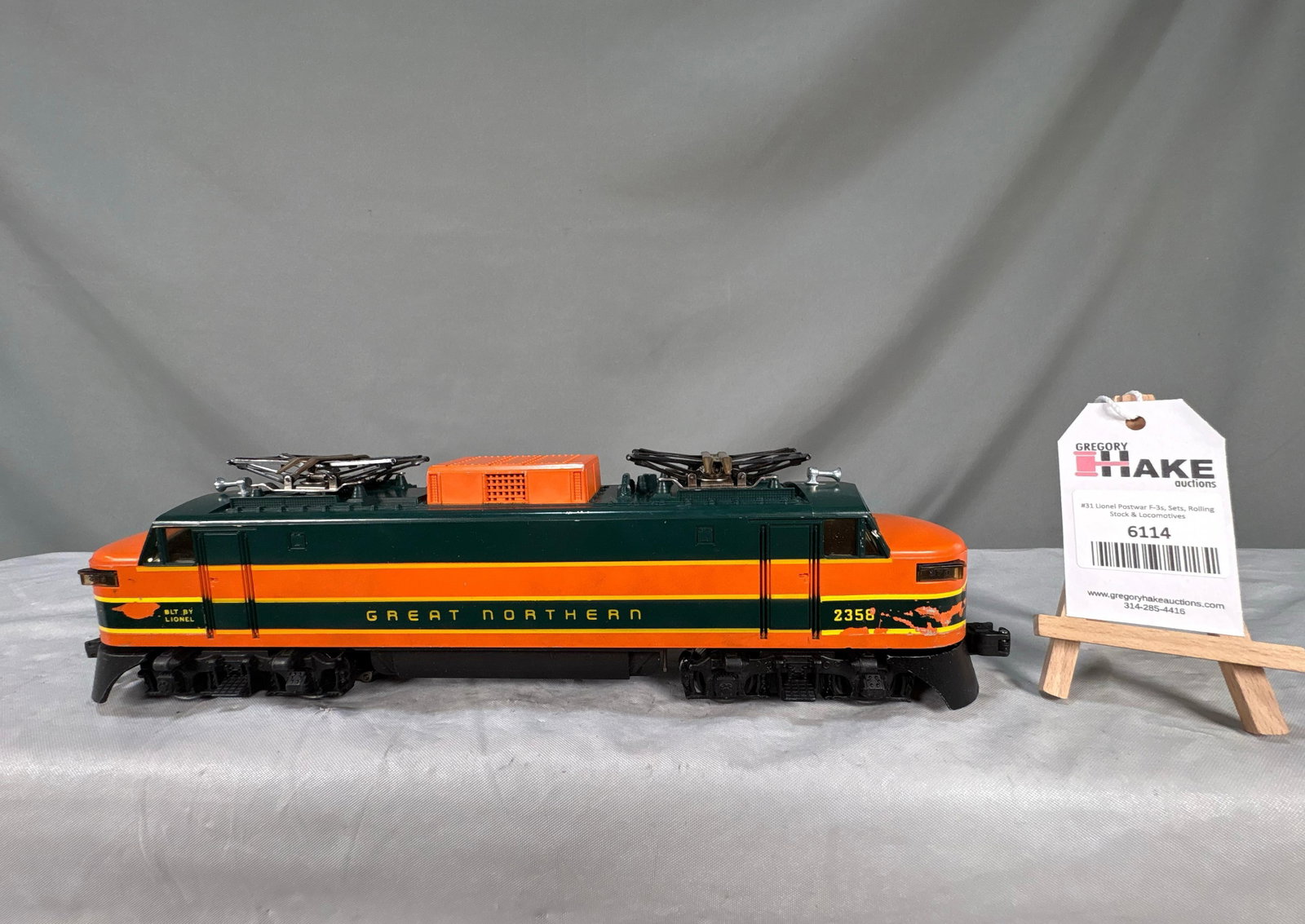 Lionel Postwar 2358 Great Northern EP 5 Electric Locomotive: Lionel Postwar 2358 Great Northern EP 5 Electric Locomotive. Original decals are flaking and there are some box rubs on the high spots, otherwise, C7.