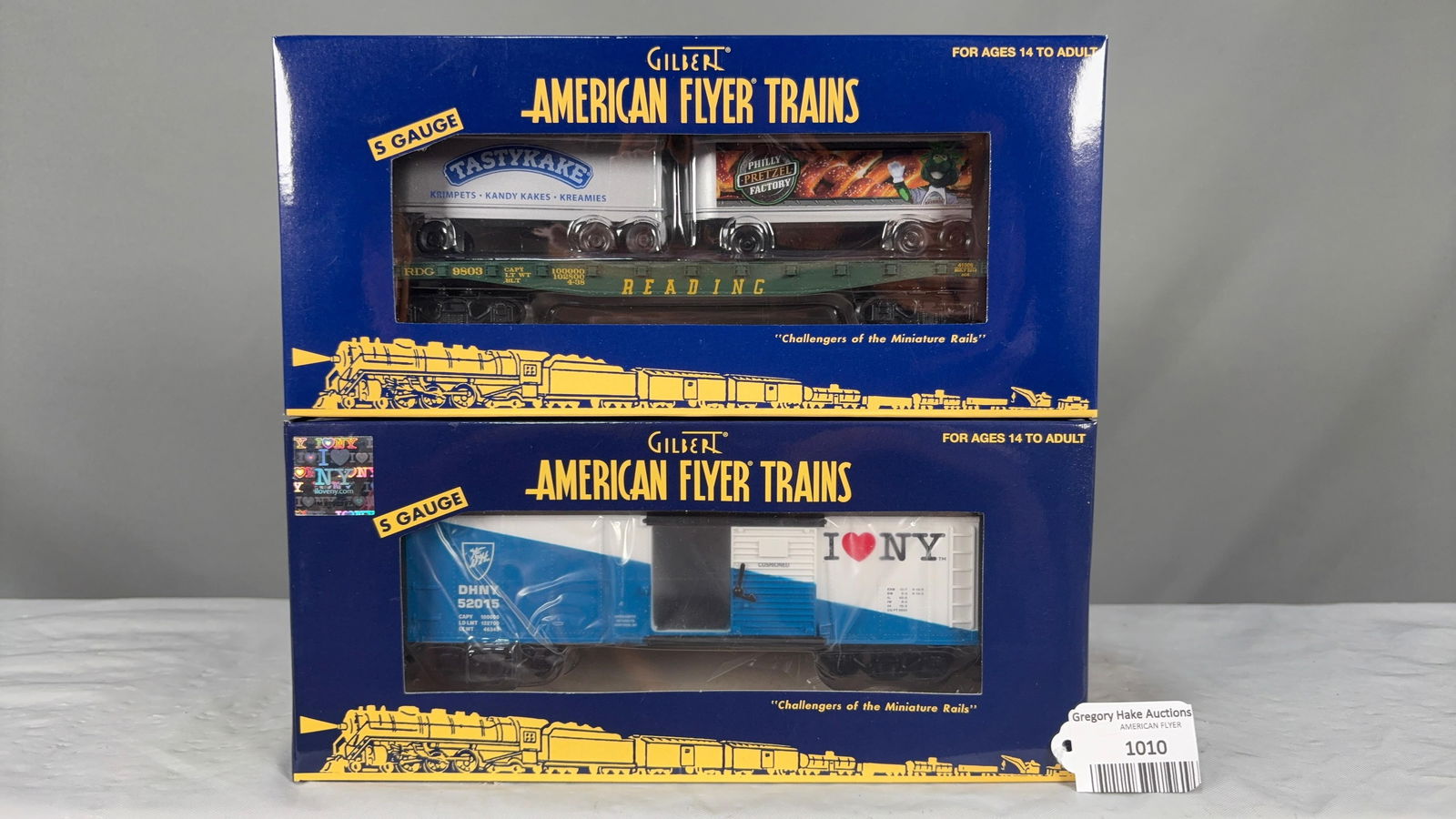 Lot of 2 Am Flyer Freight Cars:6-41006 Tasty Kake Flat Car w/Trailers and 6-41019 I Love NY w/obs (1 of 2)