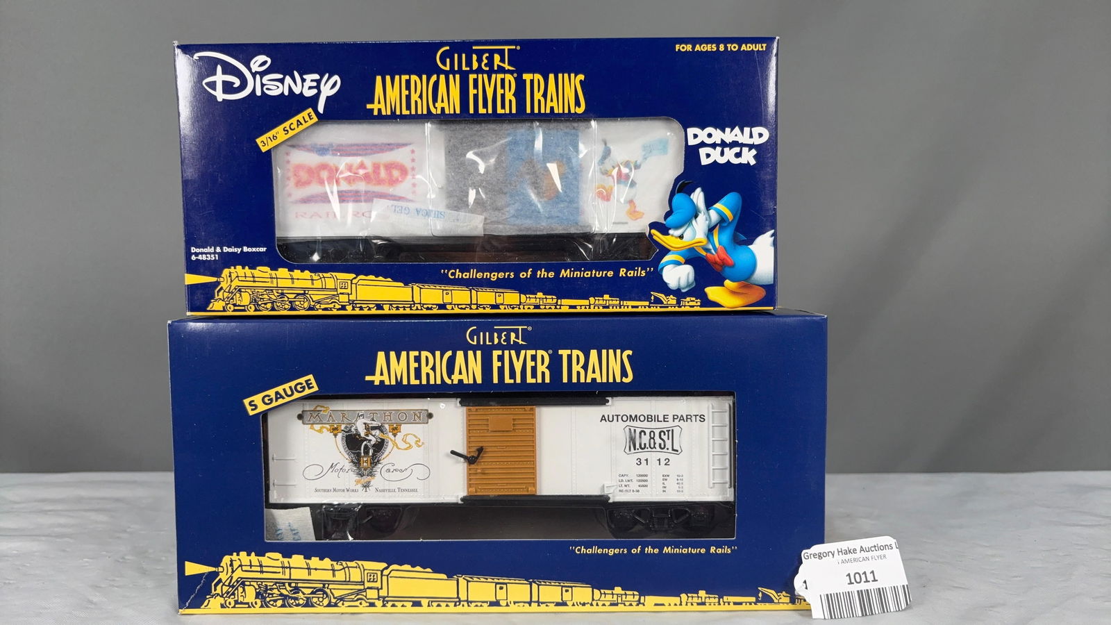 Lot of 2 AmFlyer Freight Cars 6-48351 Donald & Daisy Boxcar and 6-41001 Marathon Motors Boxcar w/obs: Lot of 2 American Flyer Freight Cars. Includes 6-48351 Donald and Daisy Boxcar and 6-41001 Marathon Motors Boxcar w/obs, C9. See photos for details.Size11x5x5