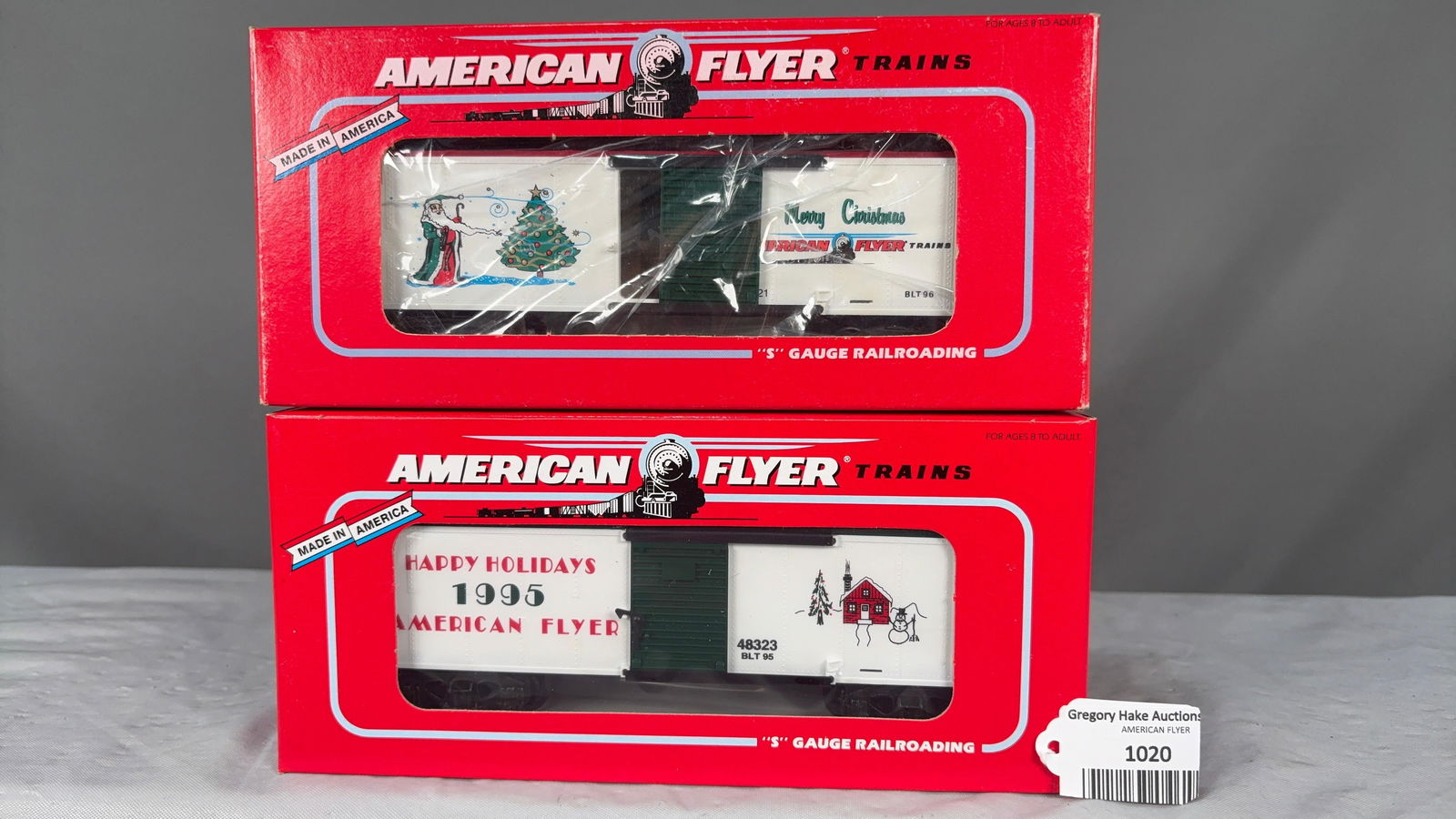 Lot of 2 American Flyer Boxcars 6-48323 1995 and 6-48325 1996 Holiday Boxcars w/obs: Lot of 2 American Flyer Boxcars. Includes 6-48323 1995 and 6-48325 1996 Holiday Boxcars w/obs. C9. See photos for details.Size11x5x5