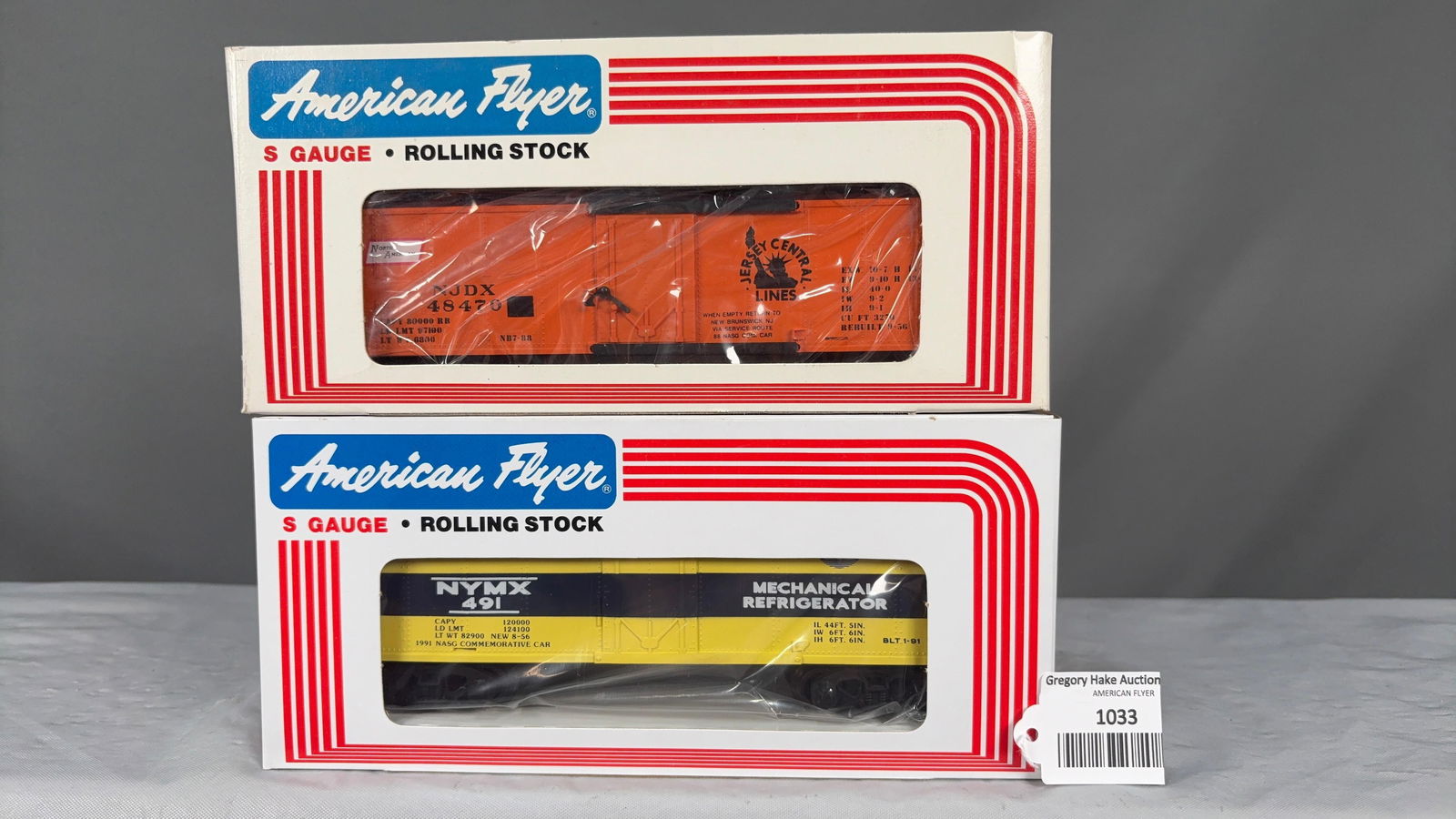 American Flyer 1988 NASG 48470 Boxcar and 1991 NASG 48436 Refrigerator Car w/obs: American Flyer 1988 NASG�Jersey Central Lines NJDX 48470 Boxcar and 1991 NASG 48436 NYMX Mechanical Refrigerator Car. C9.�See photos for details.Size11x5x5