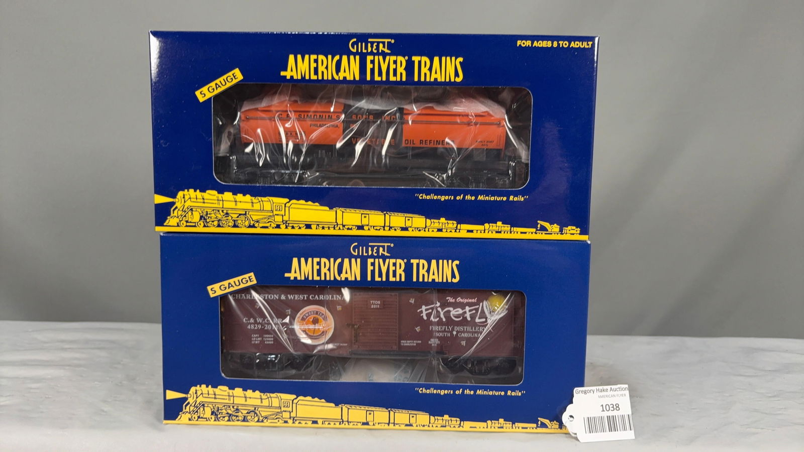 American Flyer CF Simonin's 48422 Tank Car and 2011 TTOS 48293 Firefly Sweet Tea Vodka Boxcar w/obs: American Flyer CF Simonin's 48422 Tank Car and 2011 TTOS 48293 Firefly Sweet Tea Vodka Boxcar w/obs. C9 See photos for details.Size11x5x5