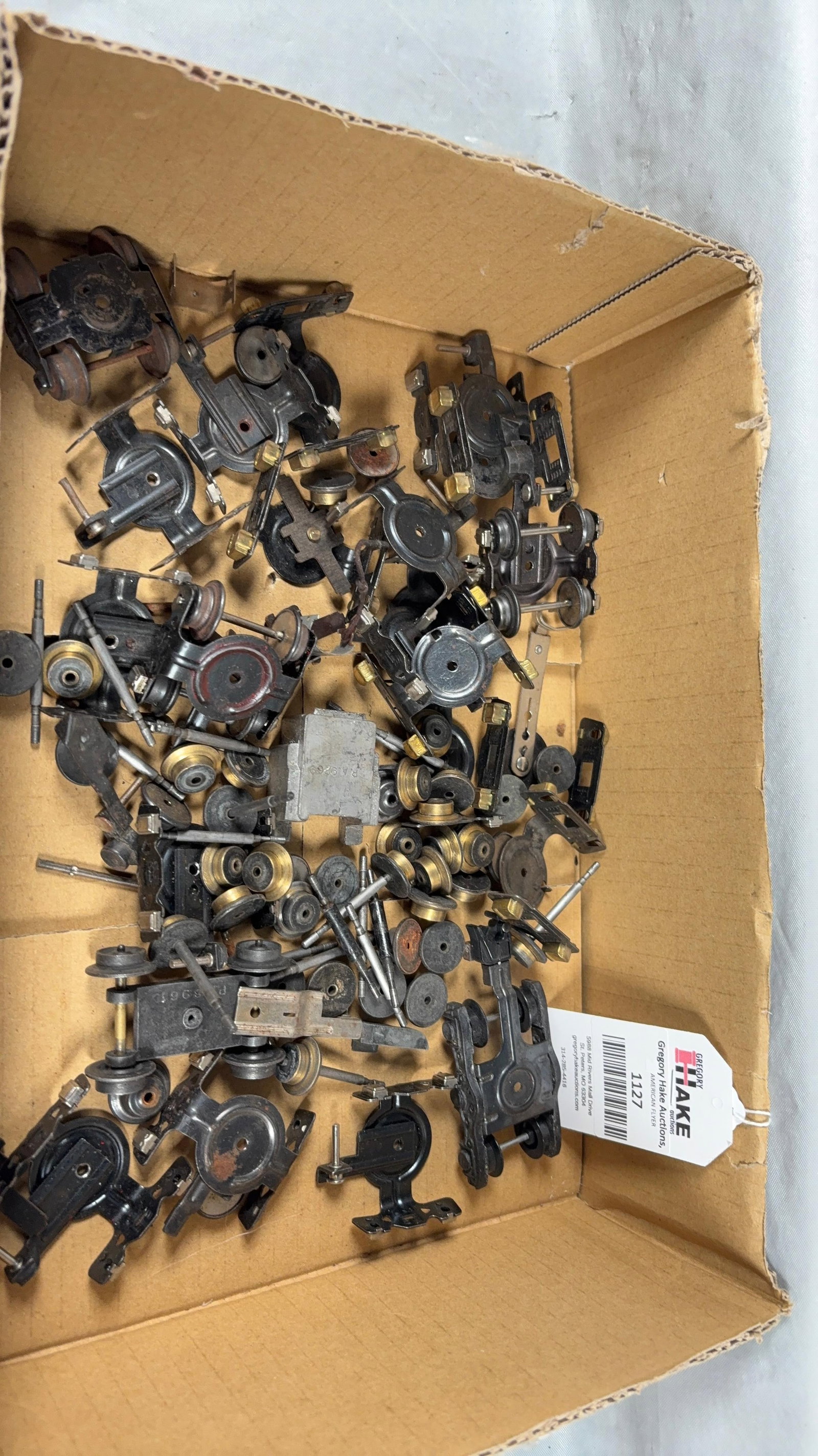 Group of American Flyer Postwar Trucks, Wheels, & Axels: Group of American Flyer Postwar Trucks, Wheels, & Axels. See photos for conditionSize14x10x2