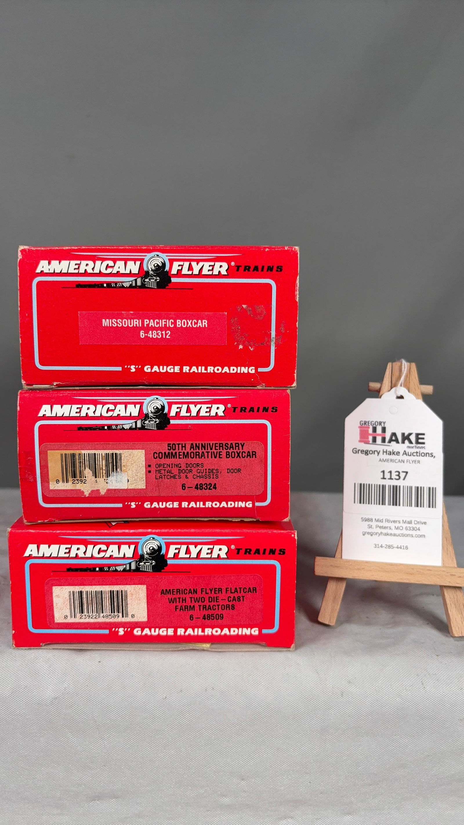 American Flyer 6-48312, 6-48324, 6-48509 w/ OB: American Flyer 6-48312 Missouri Pacific Boxcar, 6-48324 50th Anniversary Boxcar, 6-48509 Flat Car with Two Die-Cast Farm Tractors w/ OB C9 See photos for detailsSize11x5x8