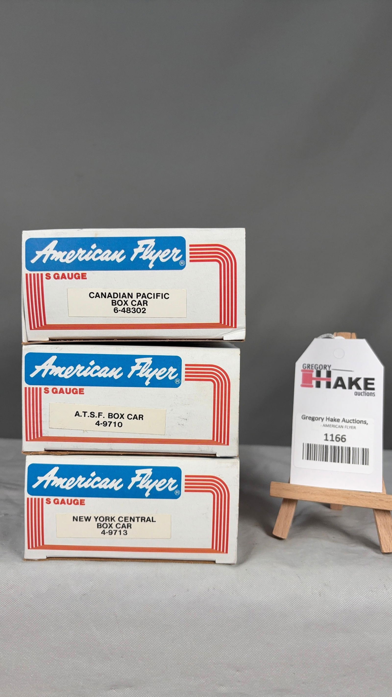 American Flyer 6-48302, 4-9710 4-9713 w/ OB: American Flyer 6-48302 Canadian Pacific Box Car, 4-9710 A.T.S.F. Box Car 4-9713NY Central Box Car w/ OB. C9 See photos for detailsSize11x5x8