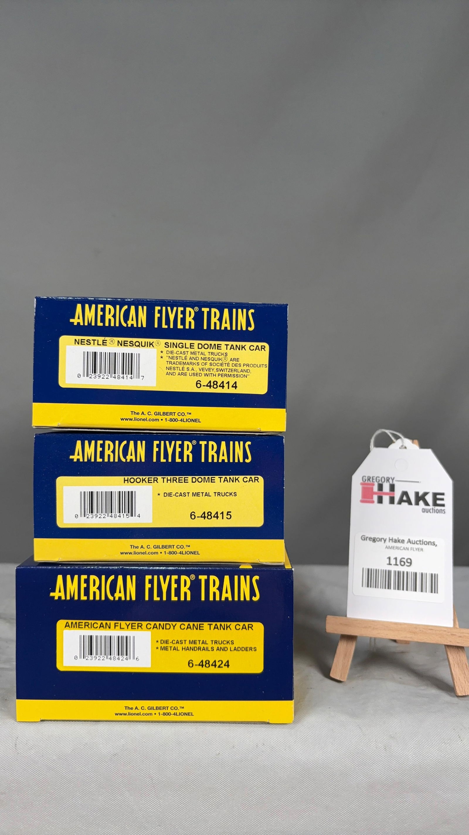 American Flyer 6-48414, 6-48415, 6-48424 w/ OB: American Flyer 6-48414 Nestle Nesquik Single Dome Tank Car, 6-48415 Hooker Three Dome Tank Car, 6-48424 A/F Candy Cane Tank Car w/ OB. C9 See photos for details Size 11x5x8