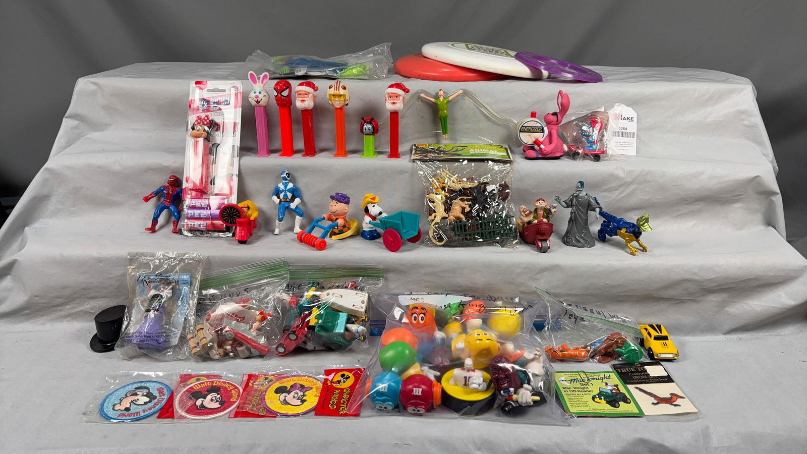 Box lot of Pez, Disney, Flintstones & Other Toys (1 of 2)