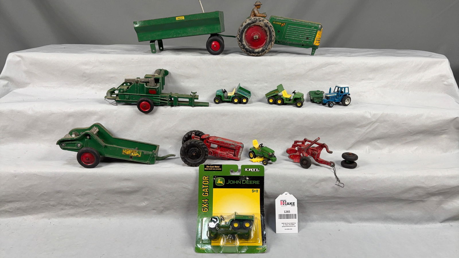 Box Lot of Vintage Farm Toys Including Oliver, Ford, Deere: Box Lot of Vintage Farm Toys Including Oliver, Ford, & John Deere.� Some are missing pieces.�See photos for detailsSize16x13x6