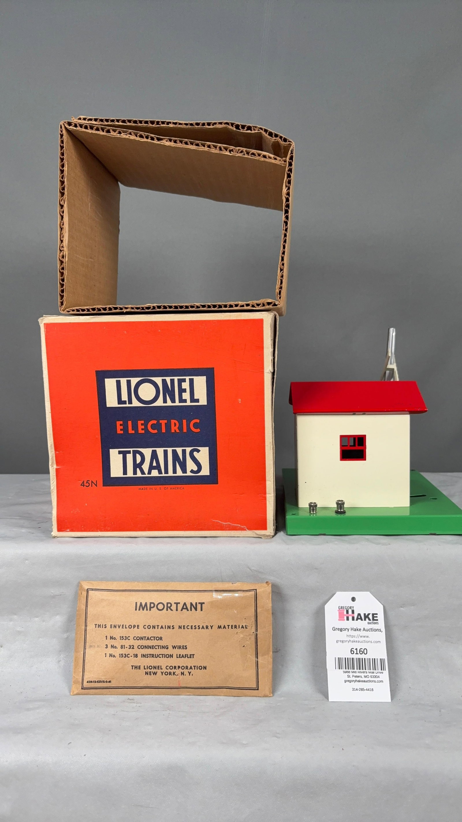 Lionel Postwar 45N Automatic Gateman w/OB: Lionel Postwar 45N Automatic Gateman w/OB, C7+. Includes empty packet, very nice and square OB with insert. Very small area has clear tape.?