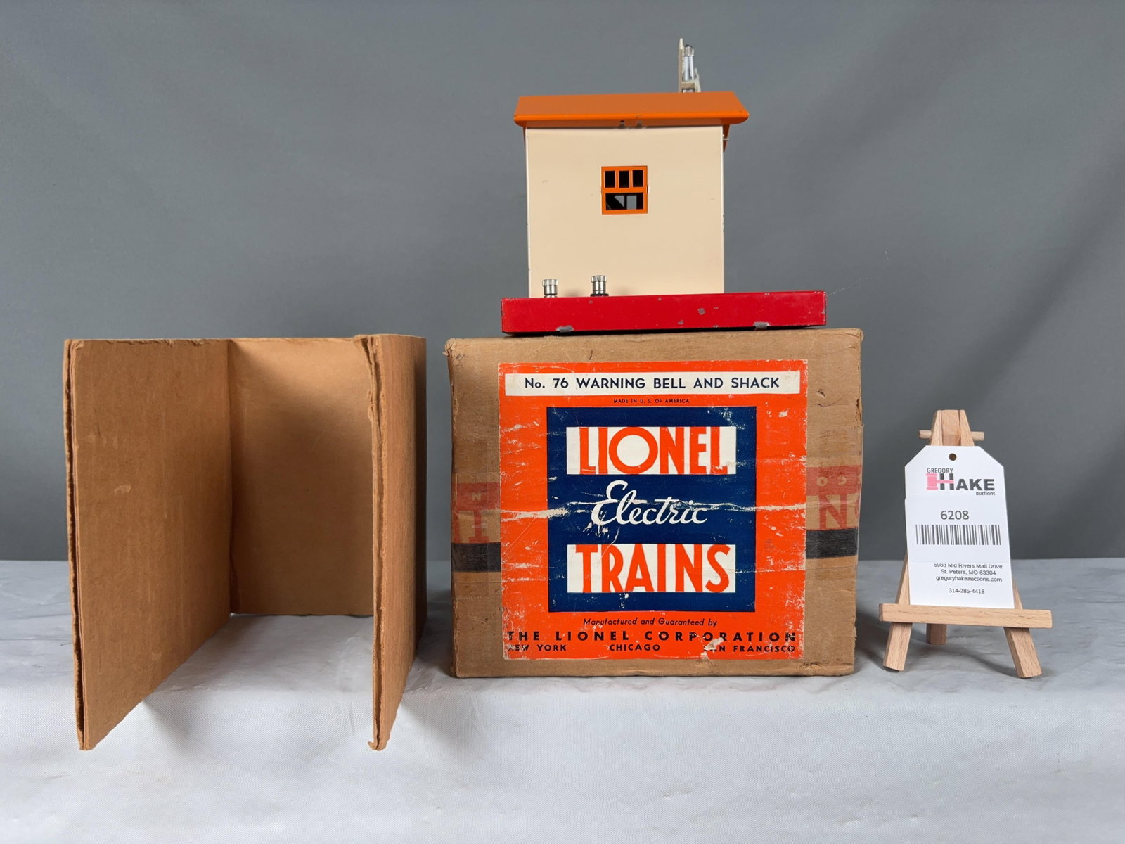 Lionel Prewar 76 Warning Bell and Shack: Lionel Prewar 76 Warning Bell and Shack. Piece is very nice except there is paint chipping on the base, otherwise?C7. Original box has a great label and has some clear tape.?