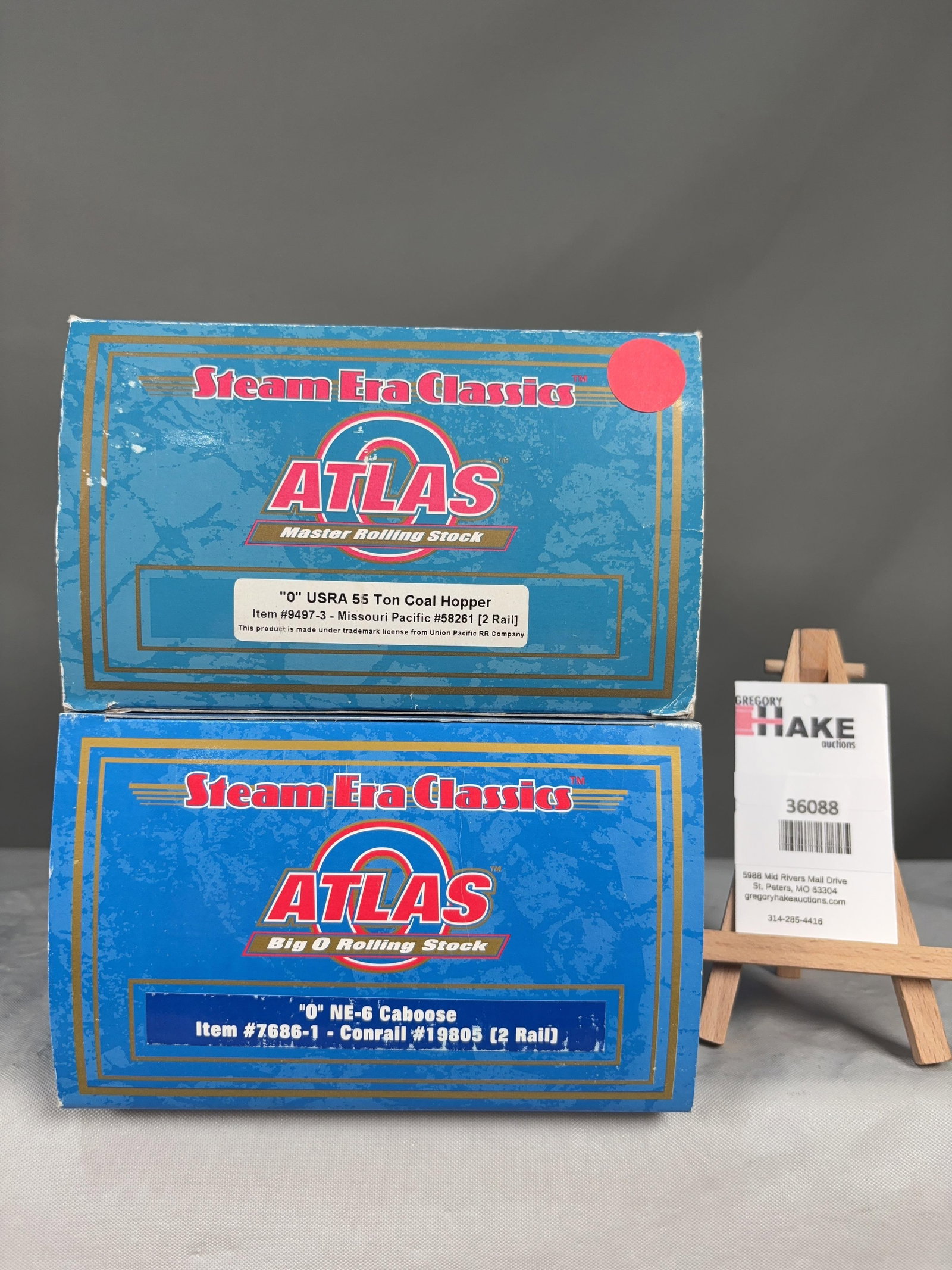 2 Atlas O Scale Coal Hopper and Caboose Cars w/OB's: 2 Atlas O Scale MP 9497-3 Coal Hopper and Conrail 7686-1 Caboose Cars w/OB's, C8. Size 17x6x8
