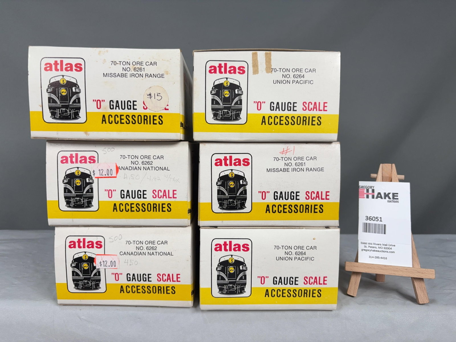 6 Atlas O Scale Cars w/OB's: 6 Atlas O Scale Cars w/OB's 2 UP Ore Cars, 2 CN Ore Cars, 2 Missabe�Iron Range�Ore Cars w/ OB, C8 Size 10x10x9