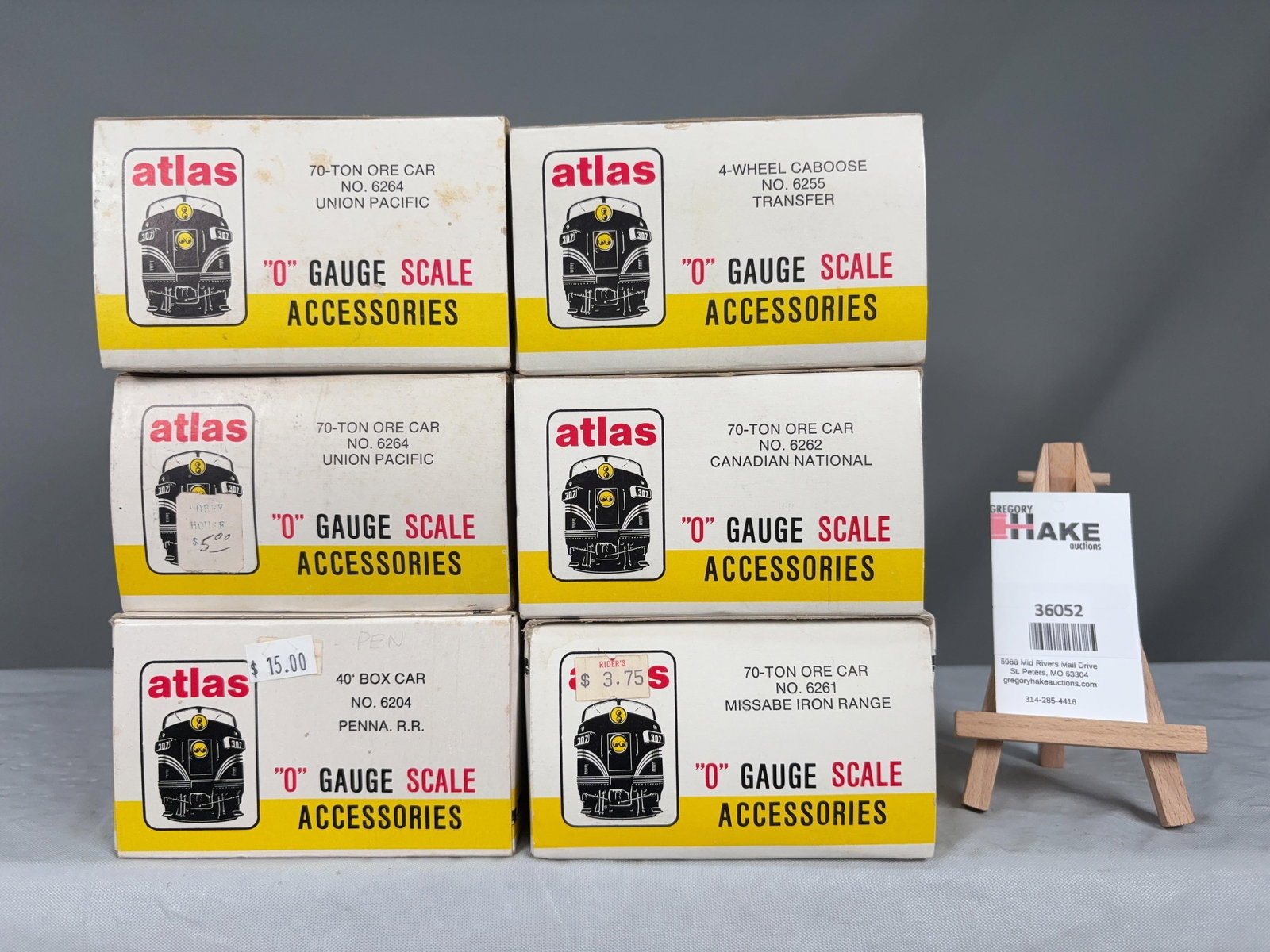 6 Atlas O Scale Cars w/OB's: 6 Atlas O Scale Cars w/OB's 2 UP Ore Cars, 1 Penna RR, Transfer Caboose, CN Ore Car, Missabe Iron Range Ore Car w/ OB, C8 Size 13x10x9