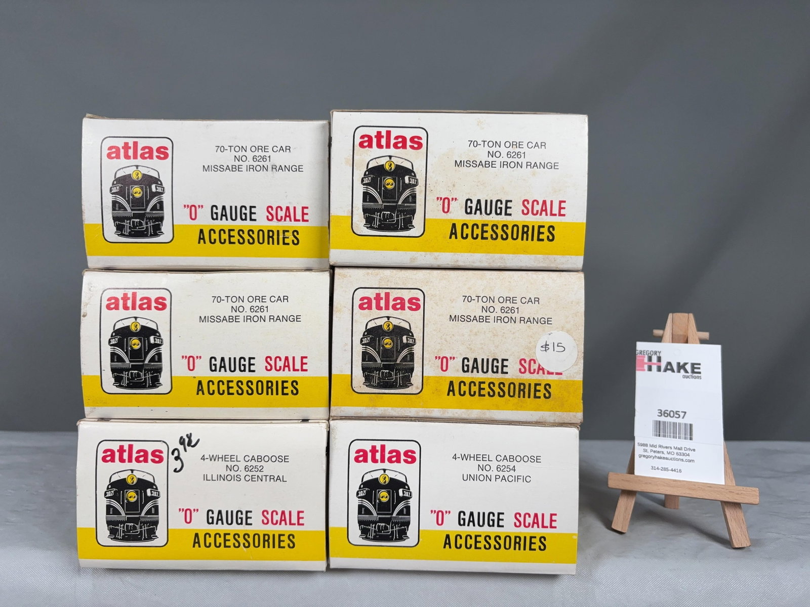6 Atlas O Scale Cars w/OB's: 6 Atlas O Scale Cars w/OB's 4 Missabe Iron Range Ore Cars, IL Central Caboose, UP Caboose w/ OB, C8 Size 10x10x9