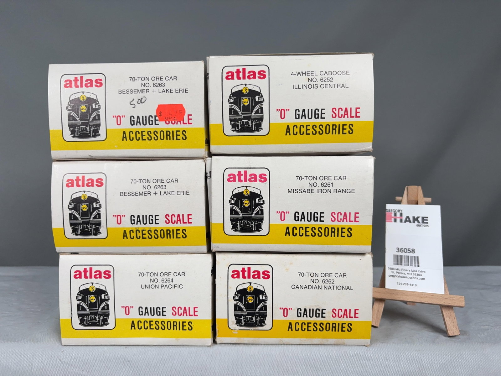6 Atlas O Scale Cars w/OB's: 6 Atlas O Scale Cars w/OB's 2 Bessemer Lake Erie Ore Cars, UP Ore Car, IL Central Caboose, Missabe�Ore Car and CN Ore Car w/ OB, C8 Size 10x10x9