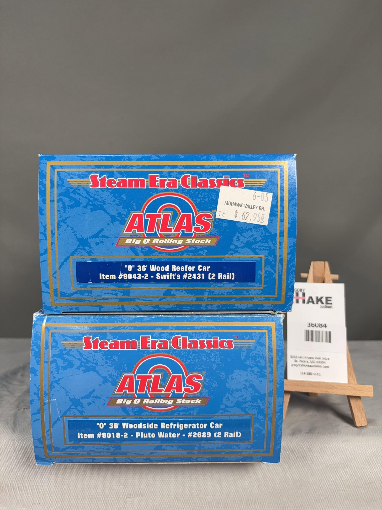 2 Atlas O Scale Refrigerator and Reefer Cars w/OB's: 2 Atlas O Scale Pluto Water 9018-2 Refrigerator and Swift's 9043-2 Reefer Cars w/OB's, C8. Size 17x6x8