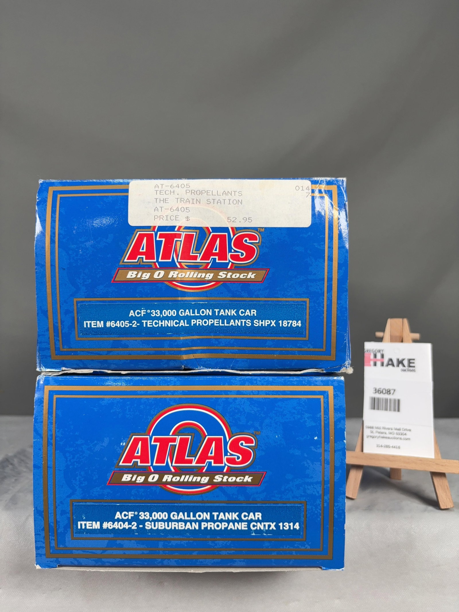 2 Atlas O Scale Tank Cars w/OB's: 2 Atlas O Scale Technical Propellants 6405-2 and Suburban Propane 6404-2 Tank Cars w/OB's, C8. Size 21x6x8