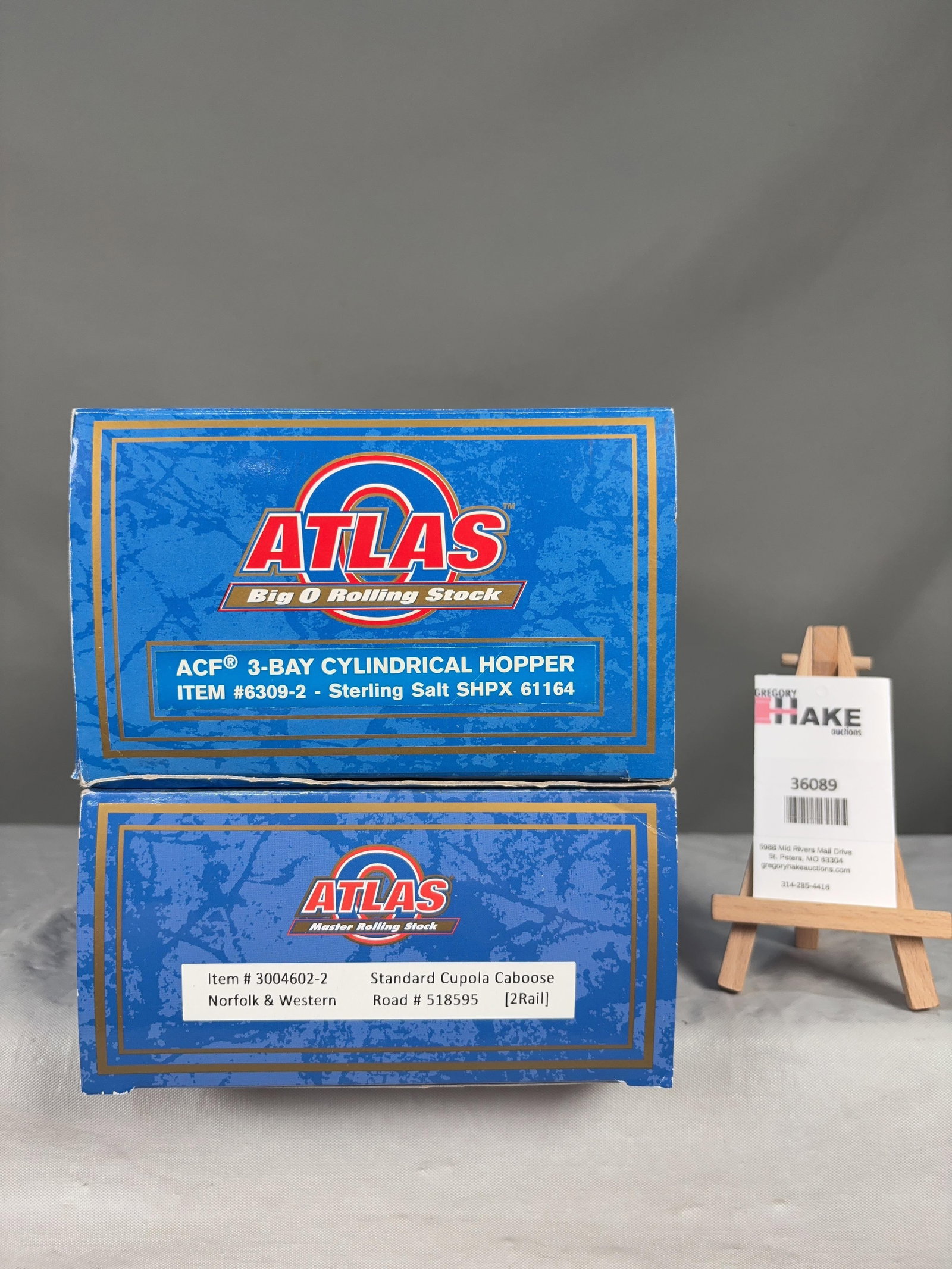 2 Atlas O Scale Hopper & Caboose Cars w/OB's: 2 Atlas O Scale Sterling Salt Cylindrical Hopper 6309-2� & N&W Cupola Caboose Cars w/OB's, C8. Size 17x6x8